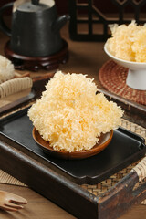 Dried White Silver Ear Fungus Tremella in Wooden Bowl Traditional Asian Food Ingredient