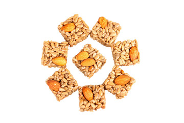 Handmade Almond Nut Energy Bars Arranged in Circle on White Background