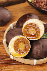 Salted Duck Eggs with Golden Runny Yolks in Bamboo Basket - Traditional Asian Delicacy