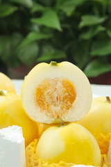 Fresh Sweet Yellow Melon Slices Cut in Half Showing Interior Seeds and Flesh