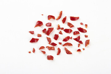 Dried Red Chili Pepper Flakes on White Background - Hot Spice Seasoning Ingredient