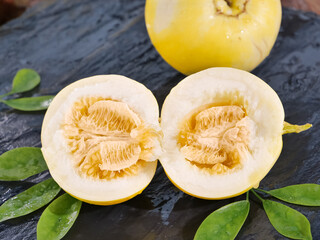 Fresh Yellow Melon Halves with Seeds on Dark Slate Background - Healthy Organic Fruit Food Photography