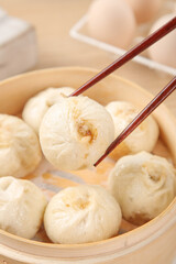 Traditional Shengzhou Soup Dumplings in Bamboo Steamer with Chopsticks - Chinese Dim Sum Cuisine