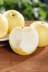 Fresh White Crown Pears from Hebei Province Show Juicy Interior on Wooden Board