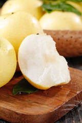 Fresh Hebei Crown Pears with White Flesh on Wooden Cutting Board