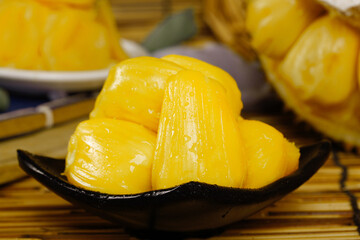 Fresh Yellow Pineapple Chunks with Honey Flesh on Black Spoon - Sweet Tropical Fruit