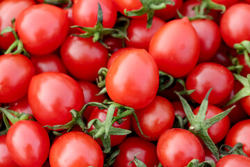 Fresh Small Cherry Tomatoes with Green Stems - Organic Vegetable Background