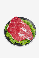 Raw Beef Brisket Cuts on Plate with Lettuce Garnish Fresh Meat for Cooking
