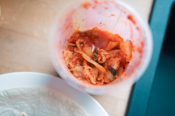 Top down view of container of kimchi