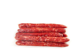 Spanish Chorizo Sausages Air-Dried Traditional Red Paprika Seasoned Meat Stack White Background
