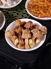 Dried Agaricus Blazei Murill Mushrooms Himematsutake in Bowl with Asian Cooking Ingredients