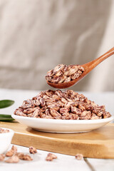 Colorful Striped Beans in Wooden Spoon Over White Plate - Healthy Nourishing Legumes Cooking Ingredient