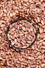 Appetizing Colorful Pinto Beans in Rustic Bowl - Healthy Legumes Food Photography