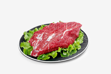 Raw Beef Brisket Cut on Plate with Lettuce Garnish for BBQ Cooking
