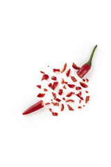 Freshly chopped red chili peppers on white background