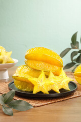 Fresh Star Fruit Slices on Plate - Tropical Yellow Starfruit Ready to Eat