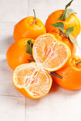Fresh Mandarin Oranges with Leaves on White Wood Background
