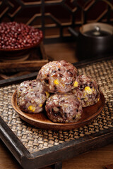Traditional Chinese Glutinous Rice Balls with Red Beans - Shandong Specialty Sticky Snacks on Wooden Plate