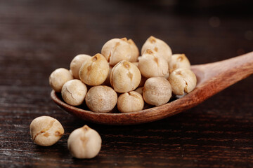 Crispy Fried Chickpeas with Five Spice Seasoning in Wooden Spoon - Xinjiang Style Cooked Legumes