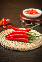 Fresh Red Hot Chili Peppers on Woven Basket - Spicy Cooking Ingredients