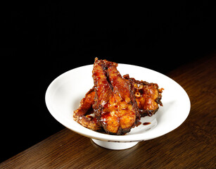 Smoked Fish Fillet Pieces with Crispy Skin on White Plate - Gourmet Seafood Cuisine