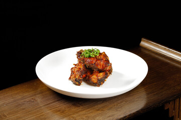 Smoked Pomfret Fish Specialty with Green Onions on White Plate - Traditional Asian Local Cuisine