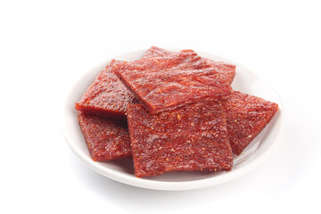 Spicy Beef Jerky Pieces on White Plate - High Protein Dried Meat Snack Food
