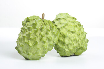 Fresh Bergamot Citrus Fruits with Textured Green Skin on White Background