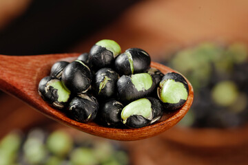 Fresh Black Beans with Green Hearts in Wooden Spoon - Healthy Legumes and Natural Cooking Ingredients