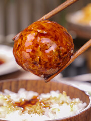 Braised Lions Head Meatball with Chopsticks Over Rice - Traditional Chinese Cuisine