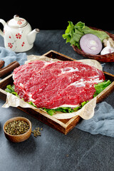 Fresh Raw Beef Brisket with Vegetables and Spices on Wooden Tray