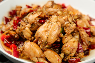 Spicy Chinese Chicken Stir Fry with Red Peppers and Chili Oil in Traditional Sichuan Style Cooking