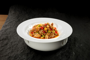 Spicy Mixed Meat Stir-Fry with Chicken Beef and Frog in White Bowl Asian Cuisine