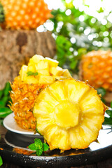 Fresh Sweet Pineapple Slices Cut and Ready to Eat on Rustic Wood Background