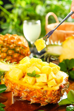 Fresh Pineapple Chunks Served in Natural Pineapple Bowl with Fork - Tropical Fruit Preparation