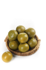 Fresh Green Limes in Wicker Basket on White Background - Citrus Fruit Food Photography