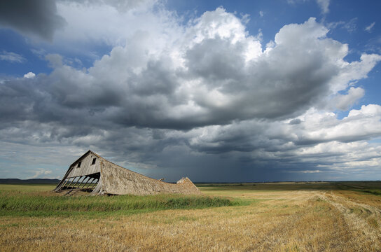 Remnants of an old country barn and a passing summer storm.