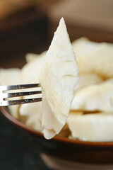 Fresh Sichuan Alpine Bamboo Shoots on Fork - Traditional Asian Mountain Vegetable Ingredient