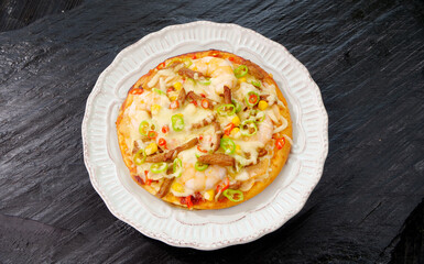 Italian Pizza with Bacon Ham and Cheese Toppings on White Plate