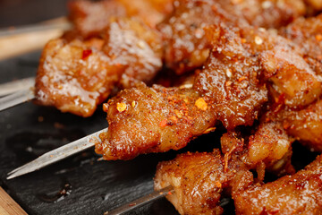 Grilled Meat Skewers Sizzling on BBQ Grill with Caramelized Glaze and Perfect Char Marks