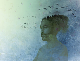 Dreamy silhouette of thoughtful man with flying birds