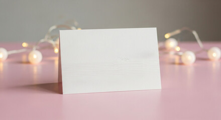 Minimalist Blank White Greeting Card with Subtle Embossed Detail and Soft String Lights