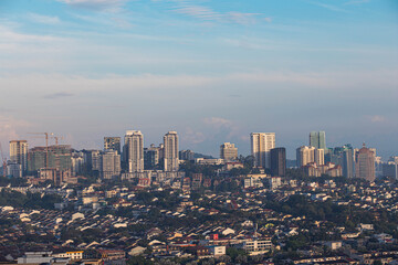 In Kuala Lumpur, towering skyscrapers stand proudly under the clear morning sky, forming a dynamic skyline that reflects the vibrant spirit, energy, and modern character of Malaysia’s capital city.