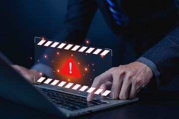 Cybersecurity warning alert on laptop with red danger symbol, representing malware attack, data breach, hacking threat, system error, online fraud, and computer security risk in digital business.