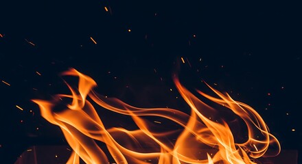 Fiery flames against dark background heat energy and combustion