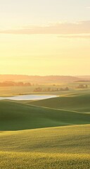 Obraz premium Golden sunrise over rolling fields