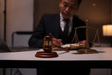 Male lawyer working on legal matters in a law office	