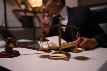 Male lawyer working on legal matters in a law office	