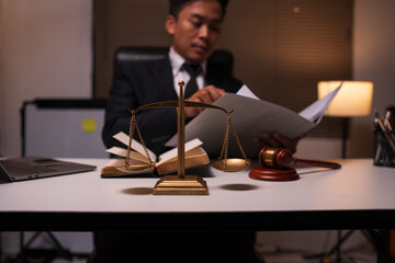 Male lawyer working on legal matters in a law office	
