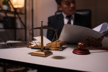 Male lawyer working on legal matters in a law office	